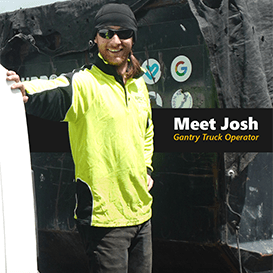 Purpose Fill Gantry Truck Operator Josh leaning against truck with smile 